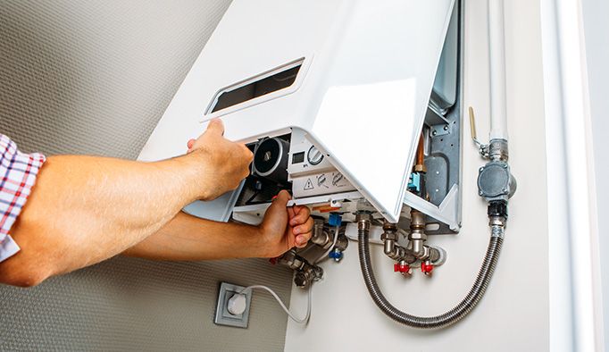 A modern boiler being installed