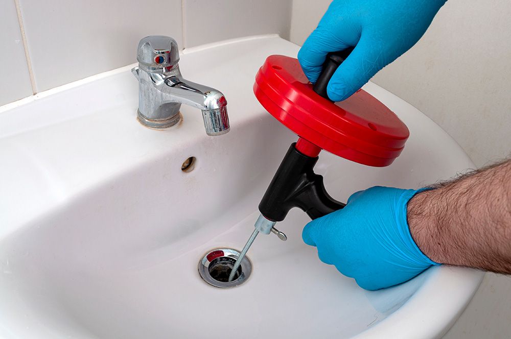 A sink being professionally unblocked