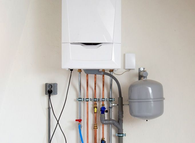 An installed boiler on a customer's wall